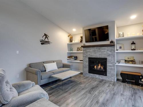 54 53004 Range Road 54A, Rural Parkland County, AB - Indoor Photo Showing Living Room With Fireplace