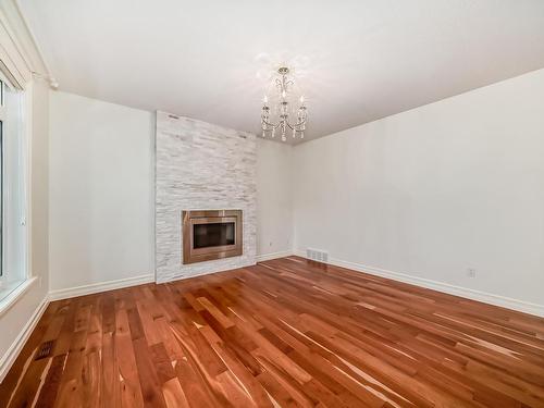 9031 24 Avenue, Edmonton, AB - Indoor Photo Showing Other Room With Fireplace