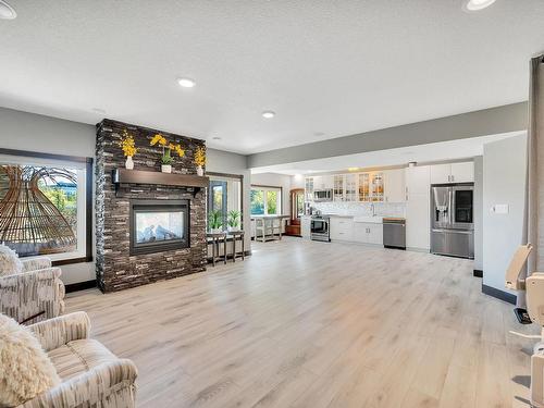 17 10550 Ellerslie Road, Edmonton, AB - Indoor Photo Showing Living Room With Fireplace