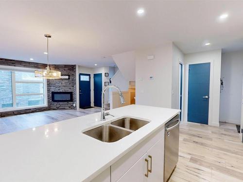 12045 95 Street, Edmonton, AB - Indoor Photo Showing Kitchen With Fireplace With Double Sink