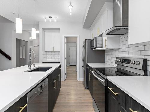 4613 66 Street, Beaumont, AB - Indoor Photo Showing Kitchen With Double Sink With Upgraded Kitchen