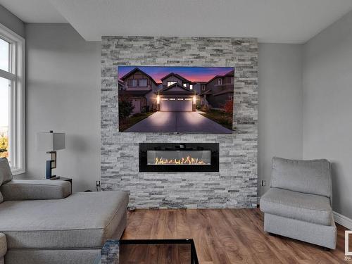 610 Eagleson Crescent, Edmonton, AB - Indoor Photo Showing Living Room With Fireplace