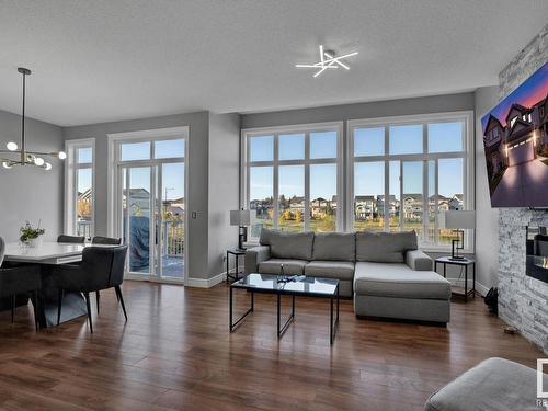 610 Eagleson Crescent, Edmonton, AB - Indoor Photo Showing Living Room With Fireplace