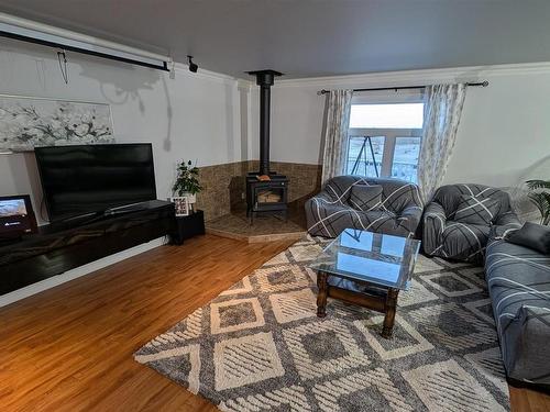 #60 50074 Range Road 233, Rural Leduc County, AB - Indoor Photo Showing Living Room With Fireplace