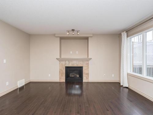 7330 Getty Heath, Edmonton, AB - Indoor Photo Showing Living Room With Fireplace