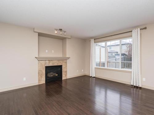 7330 Getty Heath, Edmonton, AB - Indoor Photo Showing Living Room With Fireplace