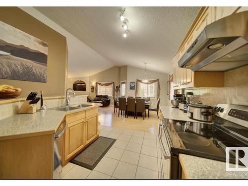 16220 49 Street, Edmonton, AB - Indoor Photo Showing Kitchen With Double Sink