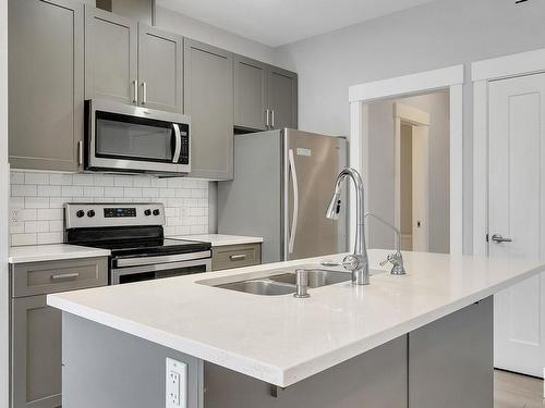 8 4835 Wright Drive, Edmonton, AB - Indoor Photo Showing Kitchen With Stainless Steel Kitchen With Double Sink With Upgraded Kitchen