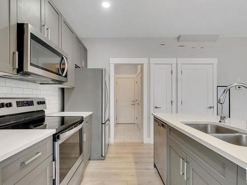 8 4835 Wright Drive, Edmonton, AB - Indoor Photo Showing Kitchen With Stainless Steel Kitchen With Double Sink