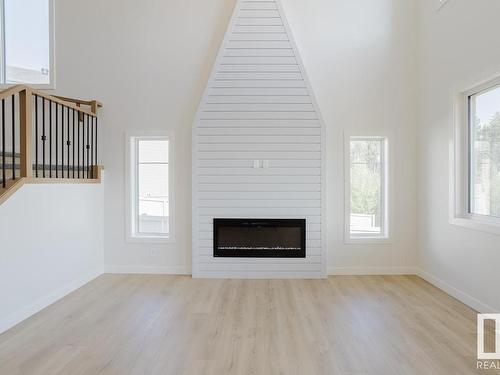 8 Meadowbrook Point(E), Spruce Grove, AB - Indoor Photo Showing Living Room With Fireplace