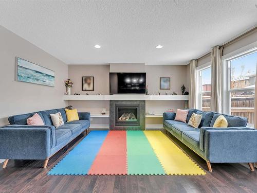 1887 33 Street, Edmonton, AB - Indoor Photo Showing Living Room With Fireplace