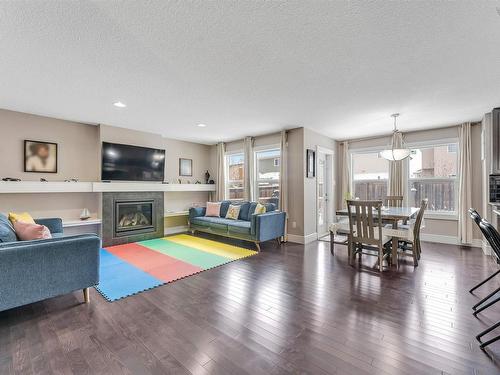 1887 33 Street, Edmonton, AB - Indoor Photo Showing Living Room With Fireplace