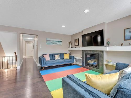 1887 33 Street, Edmonton, AB - Indoor Photo Showing Living Room With Fireplace