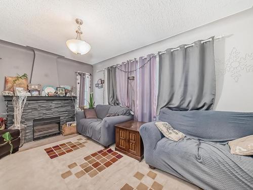 12430 76 Street, Edmonton, AB - Indoor Photo Showing Bedroom With Fireplace