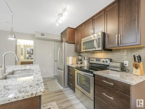 216 5510 Schonsee Drive, Edmonton, AB - Indoor Photo Showing Kitchen With Stainless Steel Kitchen With Double Sink With Upgraded Kitchen