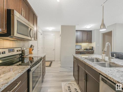 216 5510 Schonsee Drive, Edmonton, AB - Indoor Photo Showing Kitchen With Stainless Steel Kitchen With Double Sink With Upgraded Kitchen