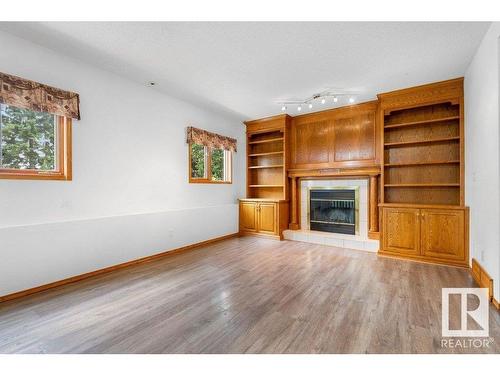 233 Northmount Drive, Wetaskiwin, AB - Indoor Photo Showing Living Room With Fireplace