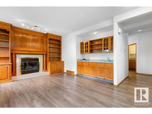 233 Northmount Drive, Wetaskiwin, AB - Indoor Photo Showing Living Room With Fireplace