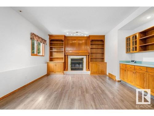 233 Northmount Drive, Wetaskiwin, AB - Indoor Photo Showing Living Room With Fireplace