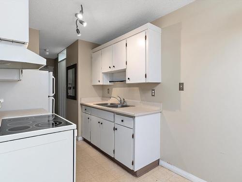 202 8310 Jasper Avenue, Edmonton, AB - Indoor Photo Showing Kitchen With Double Sink