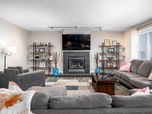 1257 Westerra Crescent, Stony Plain, AB - Indoor Photo Showing Living Room With Fireplace