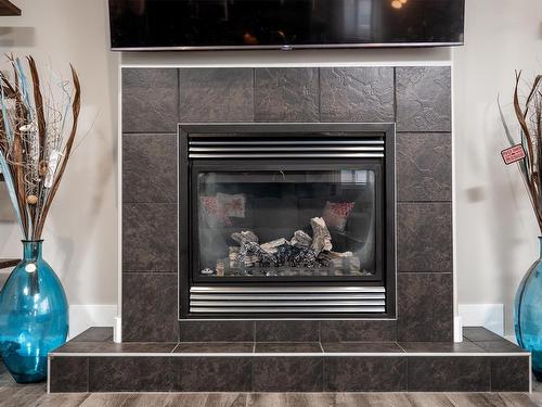 1257 Westerra Crescent, Stony Plain, AB - Indoor Photo Showing Living Room With Fireplace