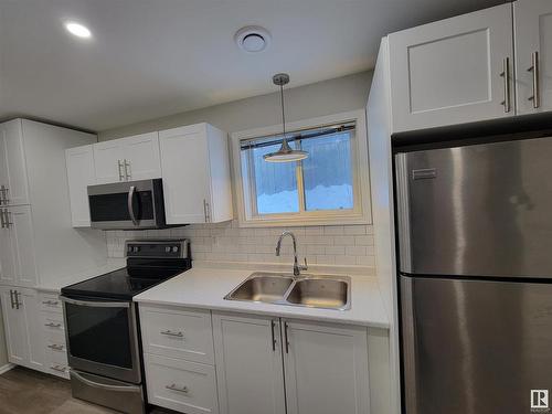 990 13 Street, Cold Lake, AB - Indoor Photo Showing Kitchen With Double Sink