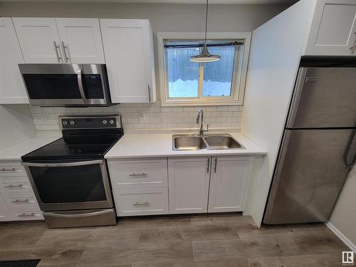 990 13 Street, Cold Lake, AB - Indoor Photo Showing Kitchen With Double Sink