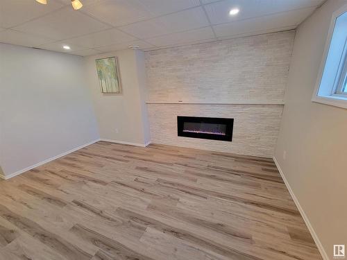 990 13 Street, Cold Lake, AB - Indoor Photo Showing Other Room With Fireplace