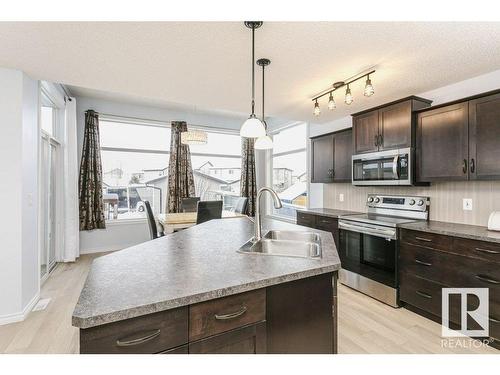 146 Southfork Drive, Leduc, AB - Indoor Photo Showing Kitchen With Double Sink