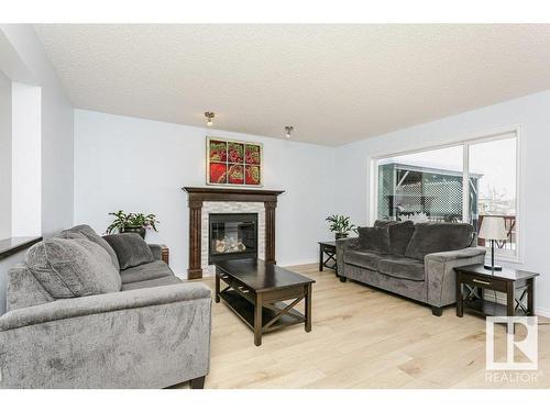 146 Southfork Drive, Leduc, AB - Indoor Photo Showing Living Room With Fireplace