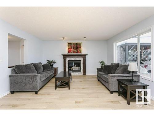 146 Southfork Drive, Leduc, AB - Indoor Photo Showing Living Room With Fireplace