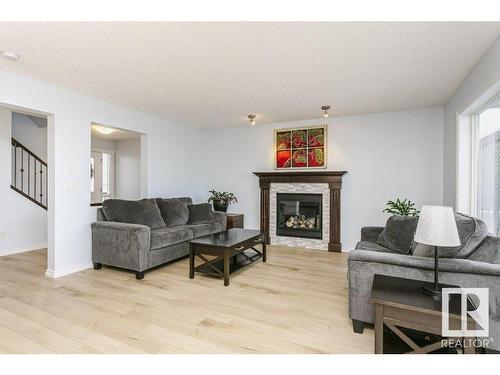 146 Southfork Drive, Leduc, AB - Indoor Photo Showing Living Room With Fireplace