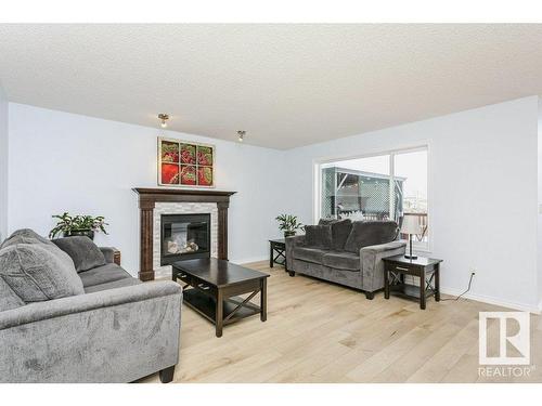 146 Southfork Drive, Leduc, AB - Indoor Photo Showing Living Room With Fireplace