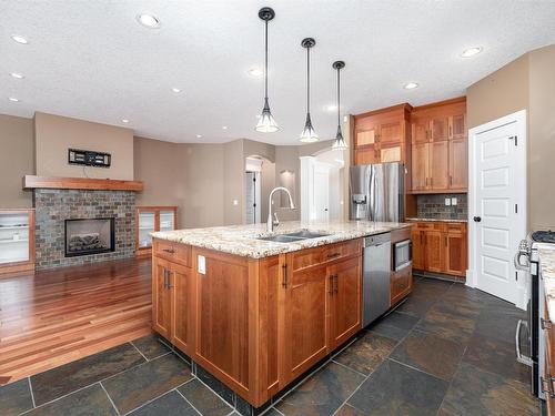 164 Greenfield Way, Fort Saskatchewan, AB - Indoor Photo Showing Kitchen With Fireplace With Double Sink With Upgraded Kitchen