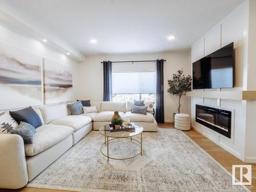 314 Juniper Cove, Leduc, AB - Indoor Photo Showing Living Room With Fireplace