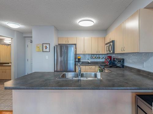 1407 10180 104 Street, Edmonton, AB - Indoor Photo Showing Kitchen With Double Sink