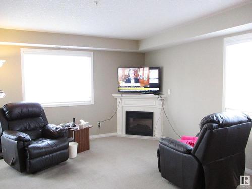 107 260 Lewis Estates Boulevard Nw, Edmonton, AB - Indoor Photo Showing Living Room With Fireplace