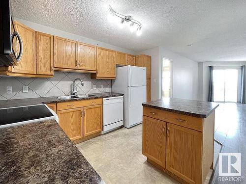 418 16035 132 Street, Edmonton, AB - Indoor Photo Showing Kitchen With Double Sink