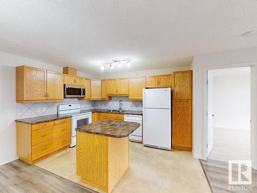 418 16035 132 Street, Edmonton, AB - Indoor Photo Showing Kitchen With Double Sink