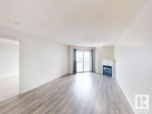 418 16035 132 Street, Edmonton, AB - Indoor Photo Showing Living Room With Fireplace