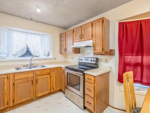 3216 41 Street, Leduc, AB - Indoor Photo Showing Kitchen With Double Sink