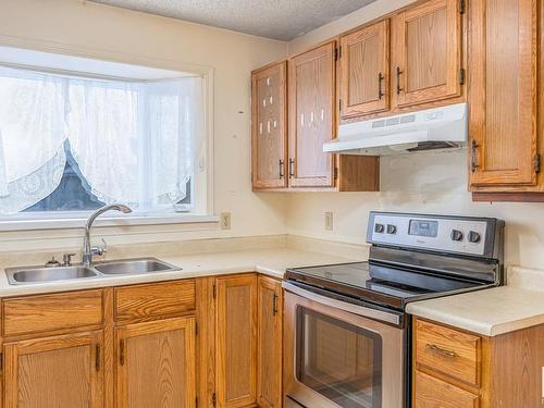 3216 41 Street, Leduc, AB - Indoor Photo Showing Kitchen With Double Sink