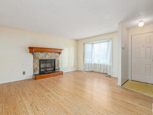 3216 41 Street, Leduc, AB - Indoor Photo Showing Living Room With Fireplace