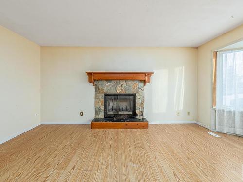 3216 41 Street, Leduc, AB - Indoor Photo Showing Living Room With Fireplace