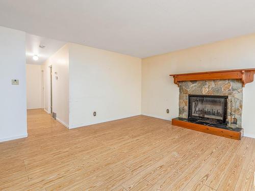 3216 41 Street, Leduc, AB - Indoor Photo Showing Living Room With Fireplace