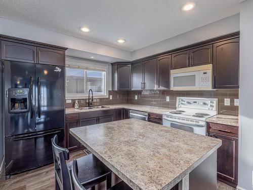 327 Nelson Drive, Spruce Grove, AB - Indoor Photo Showing Kitchen With Double Sink