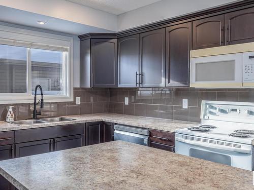 327 Nelson Drive, Spruce Grove, AB - Indoor Photo Showing Kitchen With Double Sink