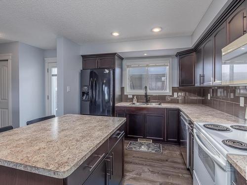 327 Nelson Drive, Spruce Grove, AB - Indoor Photo Showing Kitchen With Double Sink