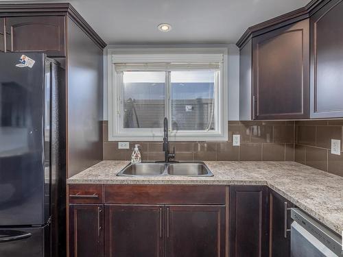 327 Nelson Drive, Spruce Grove, AB - Indoor Photo Showing Kitchen With Double Sink